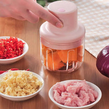 Top-down view of the Electric Mini Garlic Chopper with its lid and sharp stainless steel blade.