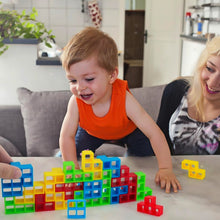Family playing balance block game toy enhancing skills