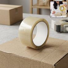A transparent packing tape roll with a white core sits on a cardboard box, with a small inset image of a person taping boxes.