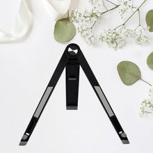 A sleek black foldable tablet stand holding a tablet at an ergonomic viewing angle.