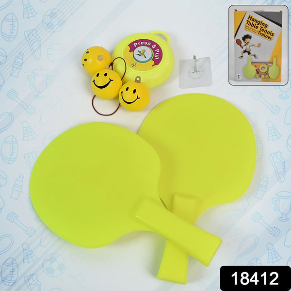 Child practicing with the hanging table tennis trainer, showing adjustable string.