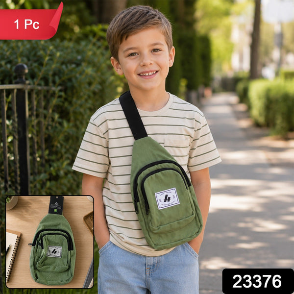 A boy with an olive green canvas sling bag and a black strap smiles at the camera, with a small inset of the bag.