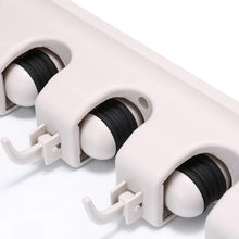 Detailed view of the durable construction of the GlimmerHome mop and broom holder.