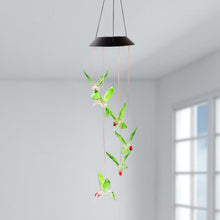 Hummingbird solar wind chimes glowing with vibrant colored LEDs