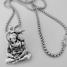 Polished metal Hanuman Pendant, reflecting light and intricate craftsmanship.