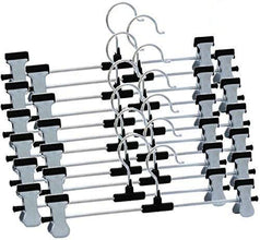 Close-up of adjustable anti-rust clips on a stainless steel hanger.