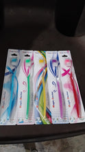 Five individually packaged 'Magic Doctor' toothbrushes with colorful designs are lined up on a dark surface.