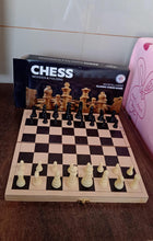 Lifestyle shot featuring the folding wooden chess set, perfect for family game nights.