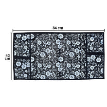 Microwave dust cover with an elegant design protecting a kitchen appliance.