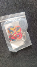 Colorful acrylic keychain featuring cartoon design with metal hardware for easy clipping