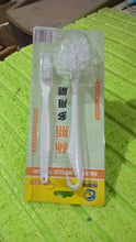 Set of cleaning brushes on a table surface