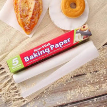 Food baking in an oven on a sheet of non-stick parchment paper for easy cleanup.