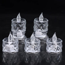 Five clear acrylic flameless LED tealight candles with clear plastic flames on a black reflective surface.