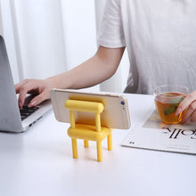 Three cute mini chair mobile stands in different angles on a wooden surface.