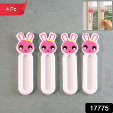 Door pull set on wooden cabinet using self stick push pull helper handles