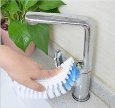 Ergonomic flexible cleaning brush angled to show effective reach for bathroom fixtures.