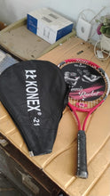 Protective cover zipped on professional tennis racket for easy carry