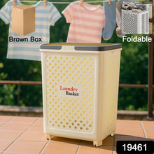 Foldable laundry basket with wheels placed in bedroom setting