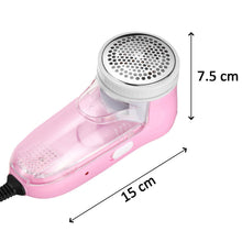 Pink corded lint remover with dimensions of 15 cm length and 7.5 cm height indicated.