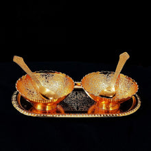 Detailed view of the elegant brass serving set, showcasing its intricate gold and silver plating.
