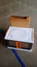 Plastic wardrobe storage container in black and white colors designed for easy organization