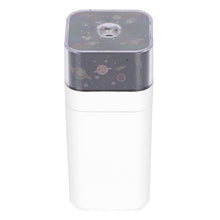 Close-up of the LED Star Night Light Projector, displaying its compact design.