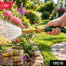 A person's hand holds a green hose with a brass nozzle spraying water into a vibrant garden. Inset shows two brass – view 2