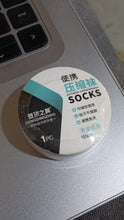 An individual using Pillowva disposable travel socks for a clean foot experience.