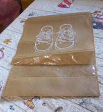 Organivo waterproof shoe bag securely holding sneakers, preventing dirt and moisture transfer.