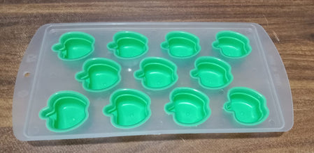 Refreshingly cool fruit-shaped ice cubes floating in a drink.