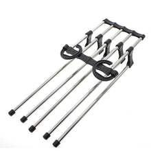 Multiple Organivo trouser hanger organizers stacked for maximum wardrobe organization.