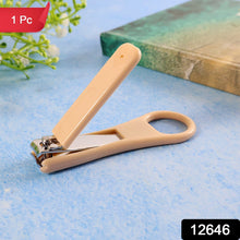 Close view of ergonomic ring-handle nail clipper showing anti-slip textured lever