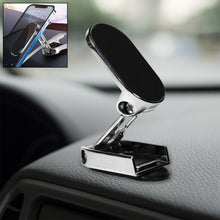 A 360° rotating magnetic car phone holder made of metal, shown on a car dashboard.