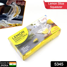Clear manual fruit juicer effortlessly extracting juice from a lemon.