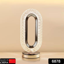 USB rechargeable crystal table lamp glowing with a warm light.
