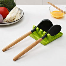 Multi-functional silicone spatula holder keeping kitchen utensils organized.