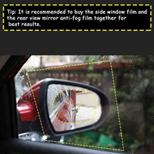 A car's side mirror with the anti fog film, providing a clear view of the road behind.