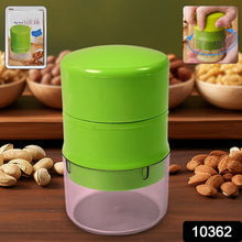 Hand using the Konvex dry fruit cutter to slice almonds and other nuts.