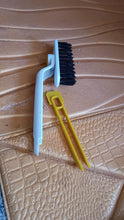 Close-up view of rotating floor scrub brush designed for tough dirt removal