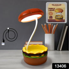Child studying with the flexible burger LED night lamp on a desk.