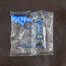 Swimmer wearing soft silicone ear plugs in clear water for ear protection