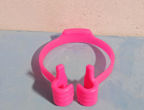 Assortment of colorful hand shape phone holders on a white background.