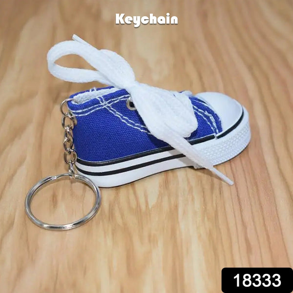 Realistic white sneaker Mini Shoe Keychain with detailed laces.