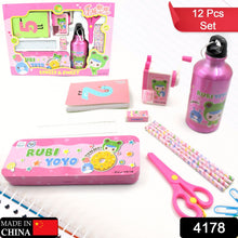 Overhead view of the 12-piece kids stationery set with pencils, ruler, eraser, and bottle.