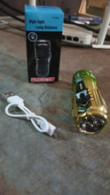 Handheld view of the mini 3 LED flashlight, emphasizing its compact and ergonomic design.