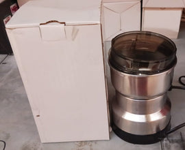 Contents of the ChefAura mini electric grinder package, including instructions.
