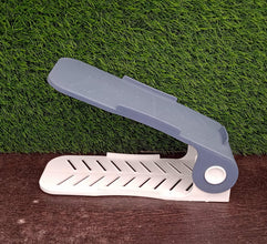 A single adjustable shoe organizer in a neutral color, showcasing its simple and functional design.