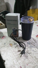 Mini electric coffee and spice grinder ready to grind fresh coffee beans.