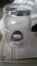 Lifestyle shot of an airtight plastic food storage jar in a modern kitchen setting.