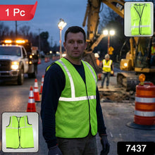 Unisex reflective safety jacket worn by a person in a construction setting.
